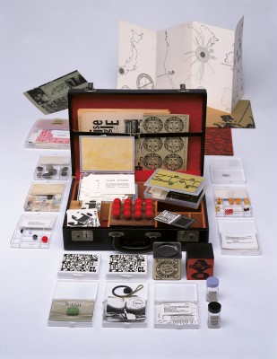 Fluxkit, 1964/65. Fluxus edition, assembled by George Maciunas. Mixed media (vinyl attaché case), printed matter. The Gilbert and Lila Silverman Fluxus Collection, Detroit / Photo: Walker Art Center. All you need to make Fluxus art is in this suitcase.
