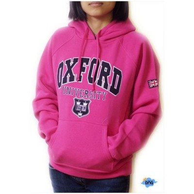 Woman in a pink Oxford University sweatshirt